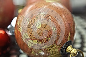 Small decorative antique globe stands .