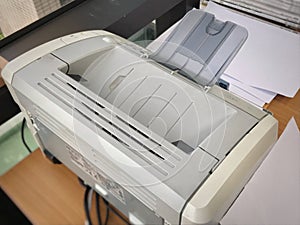 Small desktop inkjet printer on desk for printing documents