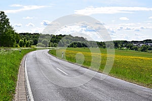 a small deteriorated country road into a small town