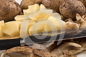 Into small dice cut organic potatoes