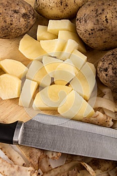 Into small dice cut organic potatoes