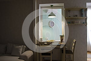 a small dining room with a view out into the living area