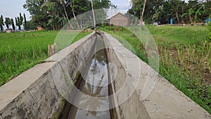 a small ditch to drain water into the fields