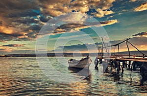 Small dock and fishing boat at fishing village, sunrise shot