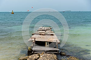 Deteriorated pier on a Colombian Caribbean beach. photo