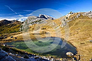 Small dolomitic Valparola lake, Valparola Pass, Dolomites, Italy