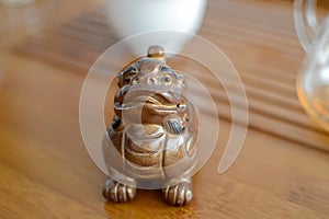 The small dragon porcelan figure used at puerh chinese tea ceremony