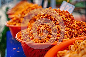 Small dried shrimp, food ingredients. Many tiny shrimps, prawns in a basket on a Vietnamese market