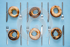 Small dry bagels with cutlery top view