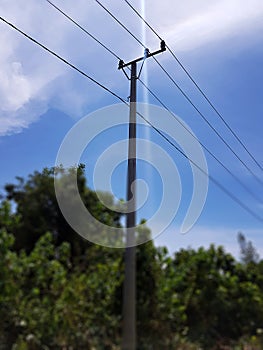 Small Electric Power Line With Blue Sky Background