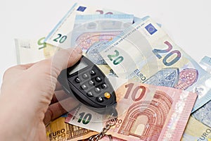 Small electronic password generator used for banking security on on euro banknotes.