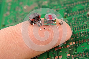 Small electronics components on human finger