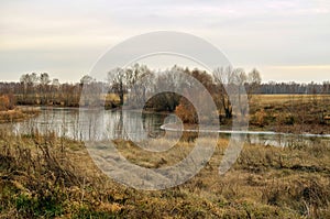 A small elongated lake among the fields