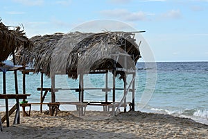 Small empty bungaloo hut with a straw roof