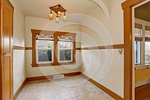 Small empty dining room interior in old craftsman style home