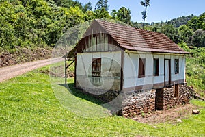 Small enxaimel house with vegetation around photo