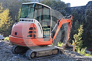 Small excavator on construction site