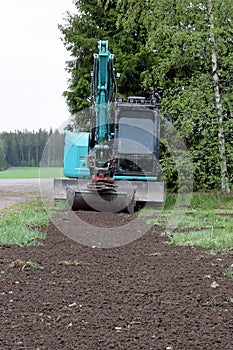 Small excavator in garden