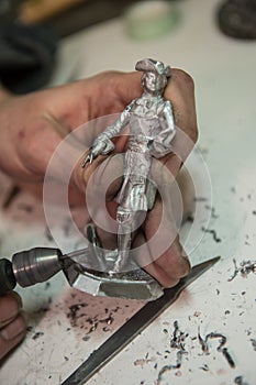 A small factory producing small batches pewter figurines. photo