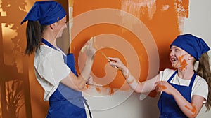 Small family having fun with renovating work at home