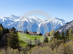 Small farm at early spring morning in Swiss alps near Leukerbad. Bodmen, Valais, Switzerland