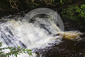 The small fast flowing river at the Glencar waterfall site