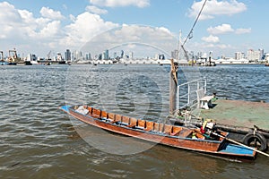 Small fast wooden boat on a river