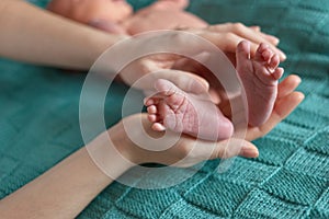 Small feet of a newborn baby.