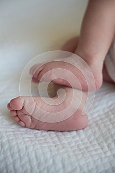 Small feet of a newborn close up. The first days of a baby`s life