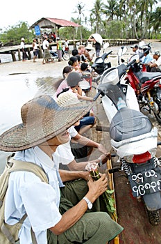 Small ferry boat full of locals trying to cross the river