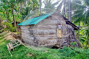 A small Filipino house in the hills, constructed from natural materials and a metal roof on Mindoro Island, Philippines.