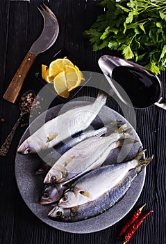 small fish on plate with spice and herb