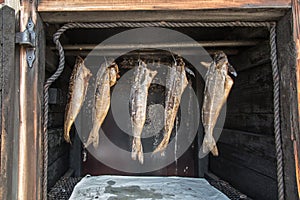 A small fish smokehouse at a roadside shop