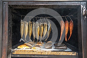 A small fish smokehouse at a roadside shop