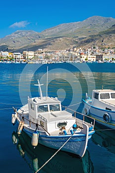 Small fisherman's boat in Greek blue and white colors in Phothia