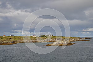 Small fishermen village on island in Helgeland archipelago in the Norwegian sea