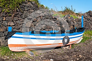 Small fishing boat aground during the winter near Catania (Sicily)