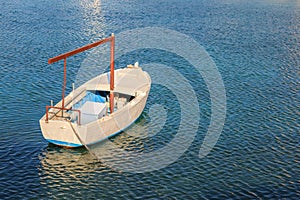 Small fishing boat in the blue Adriatic sea