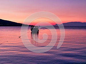 Small Fishing Boat in Corinthian Gulf Bay at Dawn, Greece