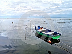 A small fishing boat in a lagoon