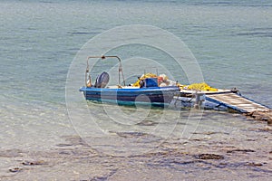 Small fishing boat at lagoon Balos