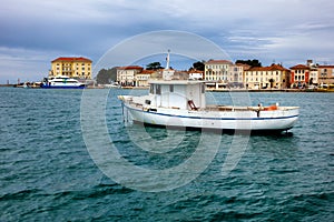 Small fishing boat in mediterranean harbor