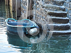 Small Fishing Boat Moored in Calm Harbour Waters