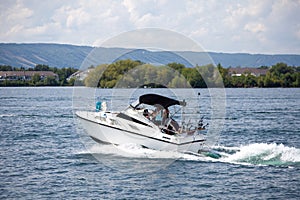 A small fishing boat returns to the Collingwood Harbor