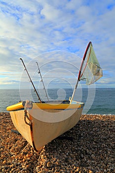 Small fishing boat with rods and net