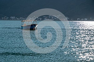 Small fishing boat at sea. Small motor boat in the sea on the Adriatic coast in Montenegro