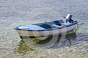 Small fishing boat on the sea in a summer day