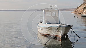 Small fishing boat in the small port