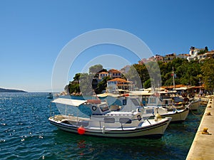 Small fishing boats anchored in the harbour of Skiathos town, Greece