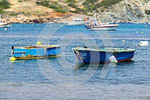 Small fishing boats off the coast in one of the bays.